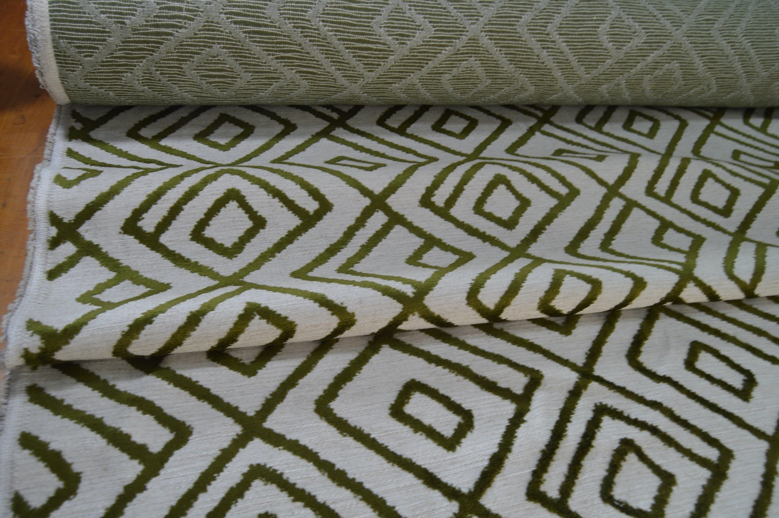 upholstery fabric embossed green geometric on cream linen style background